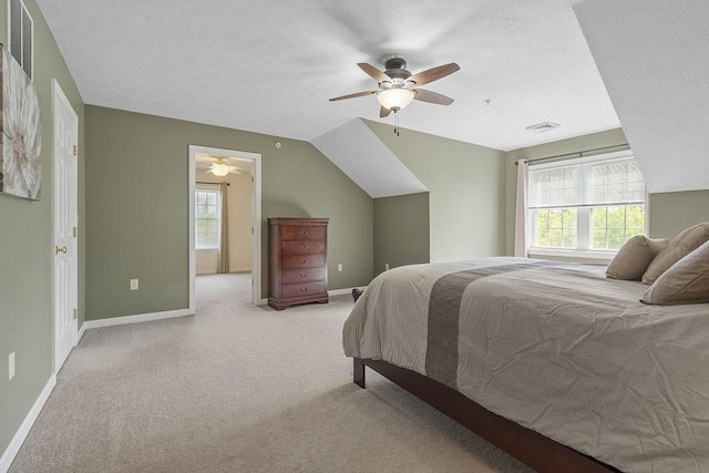 108 Green Briar Rd Unit 108, Fitchburg, MA 01420 - bedroom with light carpet, multiple windows, baseboards, and lofted ceiling