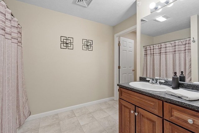 108 Green Briar Rd Unit 108, Fitchburg, MA 01420 - bathroom with vanity, baseboards, and tile patterned flooring