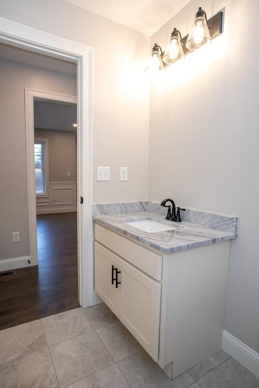 bathroom with vanity and tile patterned floors