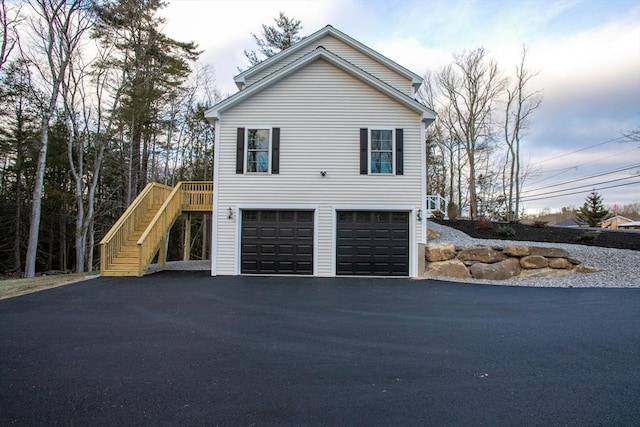 view of side of home featuring a garage