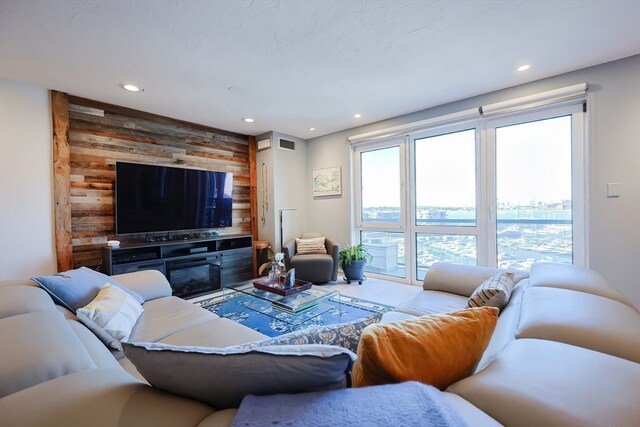 living room featuring wood walls