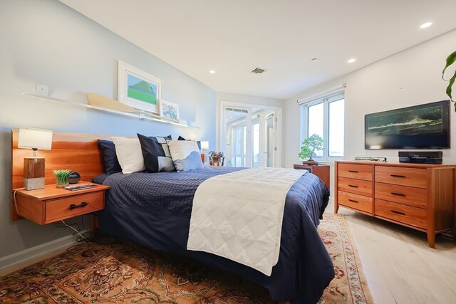 bedroom with light hardwood / wood-style flooring