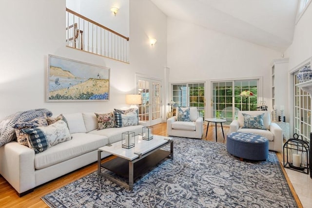 11 Forest Ln Unit 11, Scituate, MA 02066 - living area with high vaulted ceiling, wood finished floors, and french doors