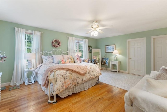 11 Forest Ln Unit 11, Scituate, MA 02066 - bedroom featuring multiple windows, light wood-style floors, and ceiling fan