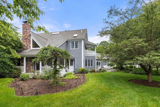 11 Forest Ln Unit 11, Scituate, MA 02066 - rear view of property with a chimney, a balcony, a lawn, a porch, and a shingled roof