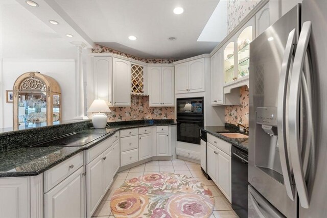 11 Forest Ln Unit 11, Scituate, MA 02066 - kitchen featuring black appliances, light tile patterned flooring, recessed lighting, backsplash, and dark stone counters