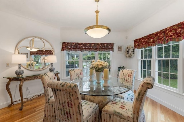 11 Forest Ln Unit 11, Scituate, MA 02066 - dining area featuring wood finished floors and ornamental molding