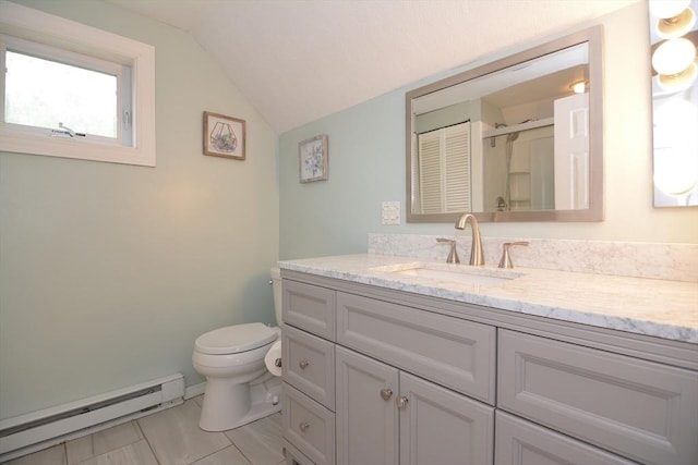 bathroom with a baseboard heating unit, lofted ceiling, toilet, vanity, and an enclosed shower