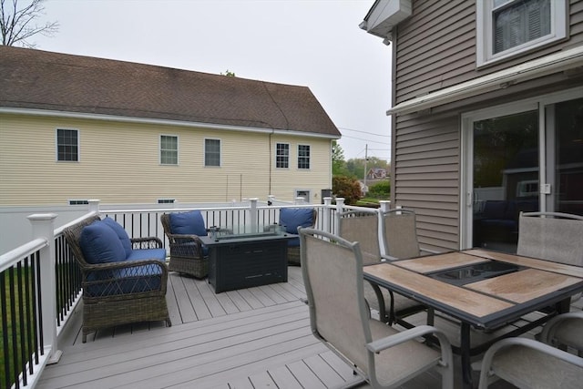 wooden terrace featuring outdoor dining area and outdoor lounge area