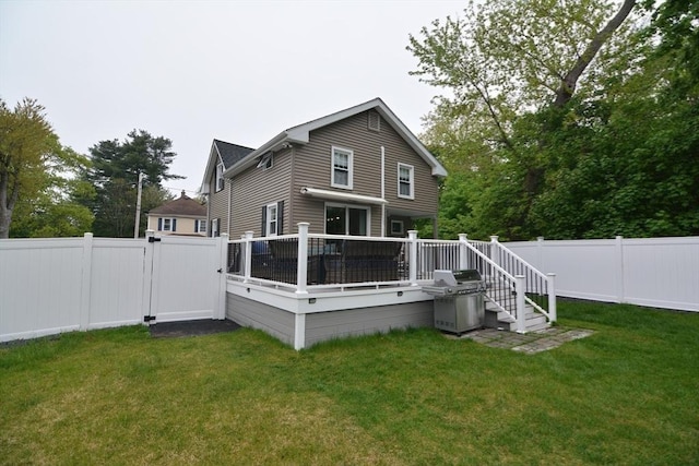 back of house featuring a wooden deck