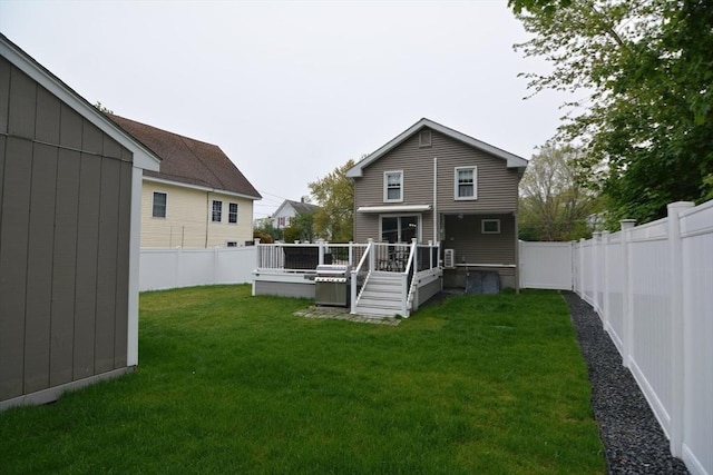 back of house with a wooden deck