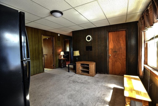 405 Warren St, Fall River, MA 02721 - carpeted living room featuring wooden walls and a paneled ceiling