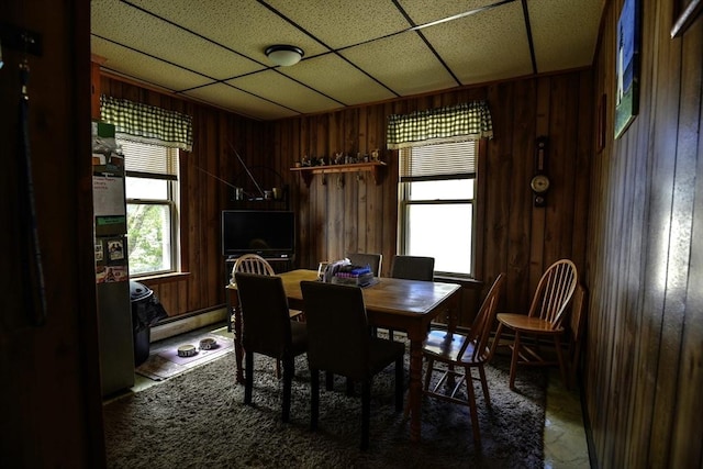 405 Warren St, Fall River, MA 02721 - dining space featuring a baseboard heating unit, wood walls, and a drop ceiling