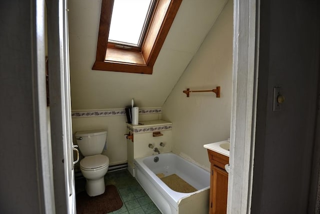 405 Warren St, Fall River, MA 02721 - bathroom featuring a skylight, lofted ceiling, toilet, vanity, and a tub to relax in