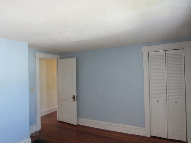 49 Vassall St, Quincy, MA 02170 - unfurnished bedroom featuring wood finished floors and a closet