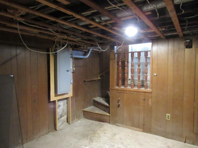 49 Vassall St, Quincy, MA 02170 - unfinished basement with electric panel, wooden walls, and stairs