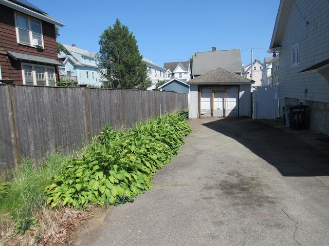49 Vassall St, Quincy, MA 02170 - exterior space featuring a residential view, an outdoor structure, and a detached garage