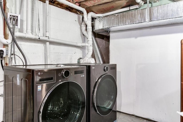 8 Lee Rd, Sharon, MA 02067 - laundry room with concrete block wall, washing machine and dryer, and laundry area