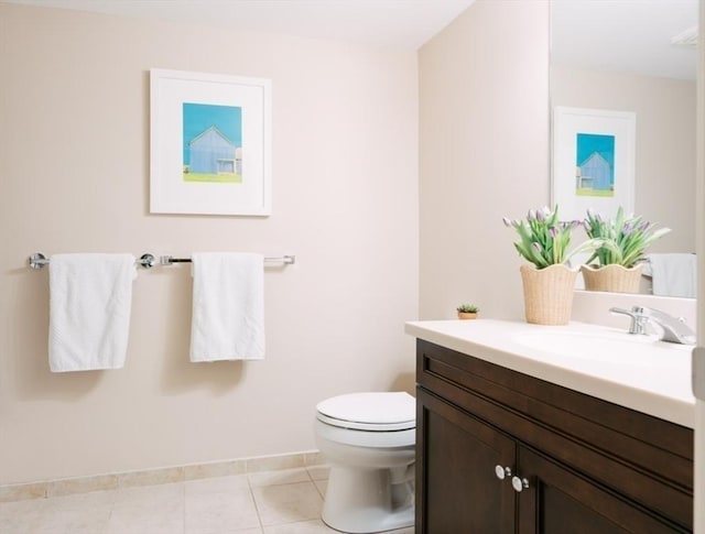 bathroom with tile patterned floors, vanity, and toilet