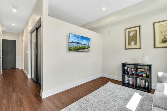 living area with dark hardwood / wood-style flooring