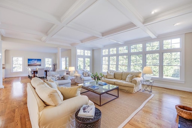 living room with coffered ceiling, decorative columns, beam ceiling, and light wood-type flooring