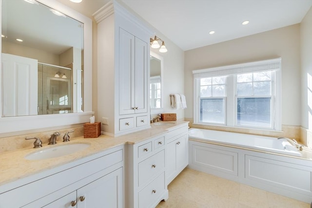 bathroom featuring vanity, shower with separate bathtub, and tile patterned flooring