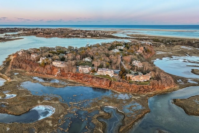 aerial view at dusk with a water view