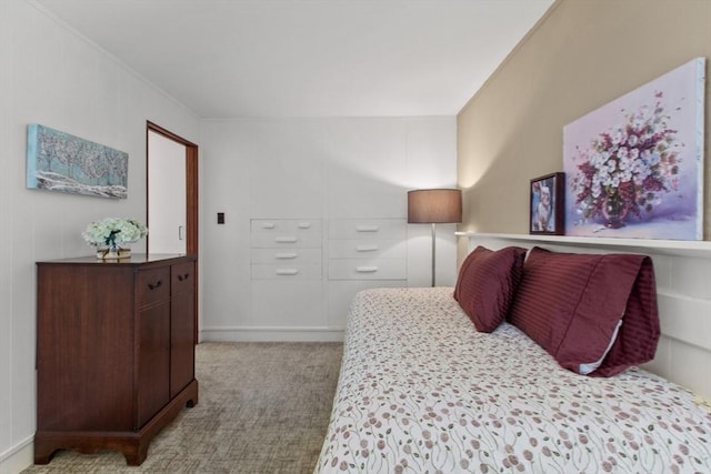 bedroom with carpet flooring and ornamental molding
