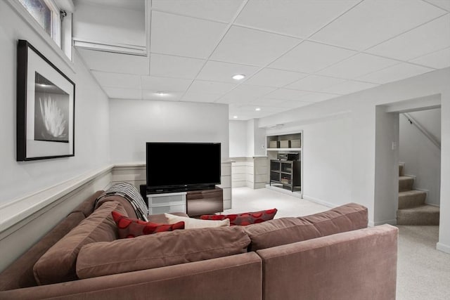 carpeted living room featuring stairway, recessed lighting, and a paneled ceiling