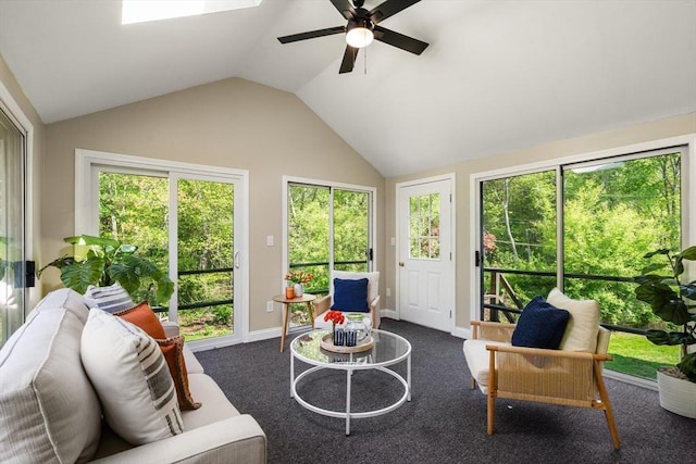 sunroom / solarium featuring vaulted ceiling and a skylight