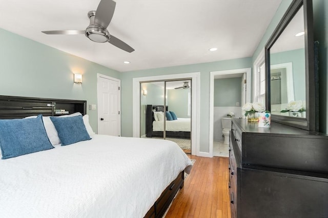 bedroom with a closet, hardwood / wood-style floors, recessed lighting, a ceiling fan, and ensuite bathroom