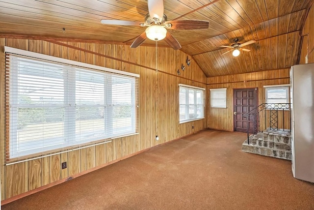 interior space featuring ceiling fan, wooden ceiling, and vaulted ceiling