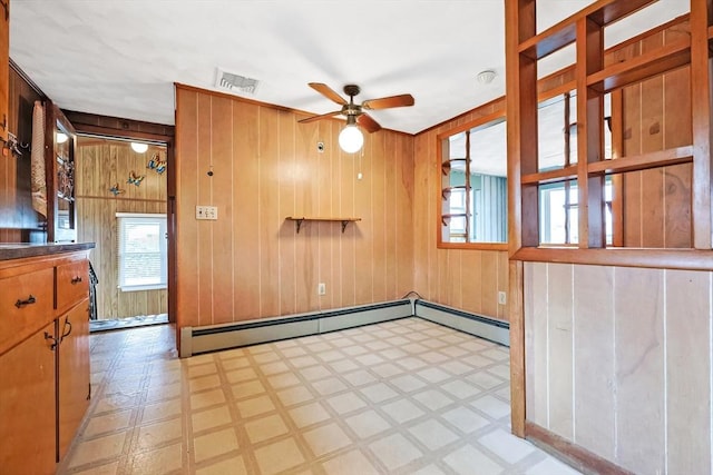 interior space featuring tile patterned floors, visible vents, and plenty of natural light