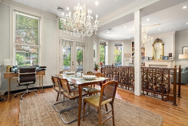 341 Beacon Unit 2F, Boston, MA 02116 - dining space with a chandelier, ornamental molding, wood finished floors, a desk, and french doors
