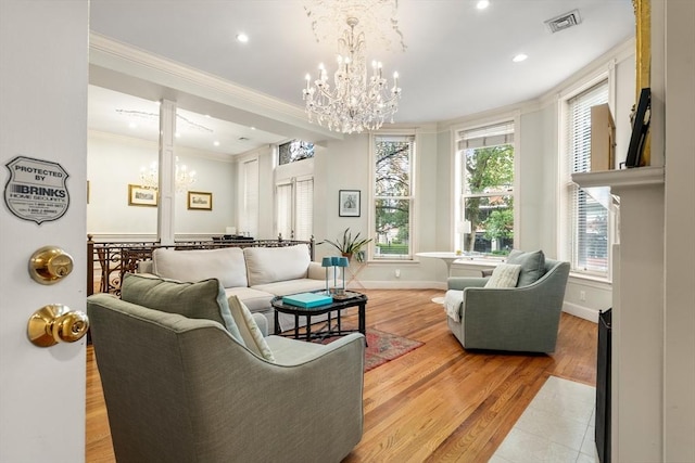 341 Beacon Unit 2F, Boston, MA 02116 - living area featuring ornamental molding, a chandelier, recessed lighting, light wood-type flooring, and decorative columns