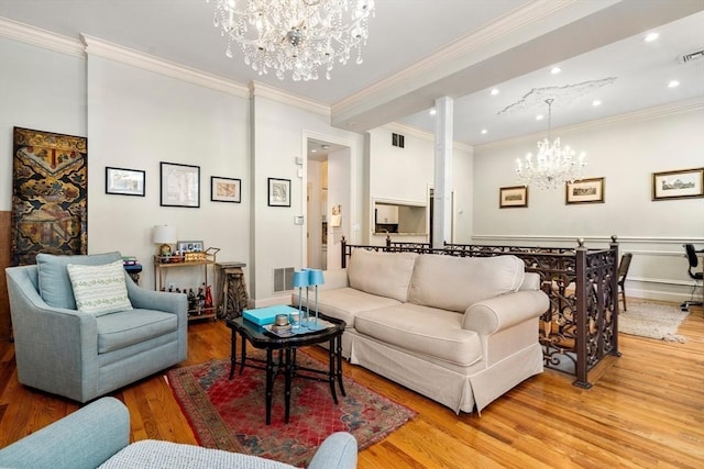 341 Beacon Unit 2F, Boston, MA 02116 - living room with a chandelier, light wood-style floors, crown molding, and recessed lighting