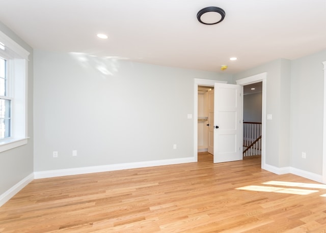 spare room with light hardwood / wood-style flooring