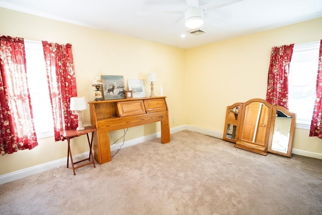 miscellaneous room featuring ceiling fan and light carpet