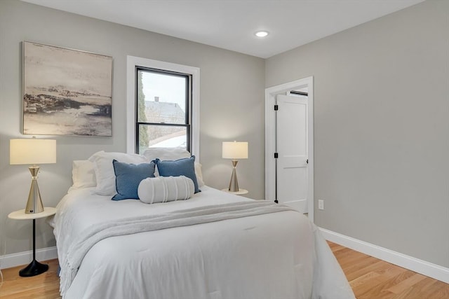 bedroom with wood-type flooring