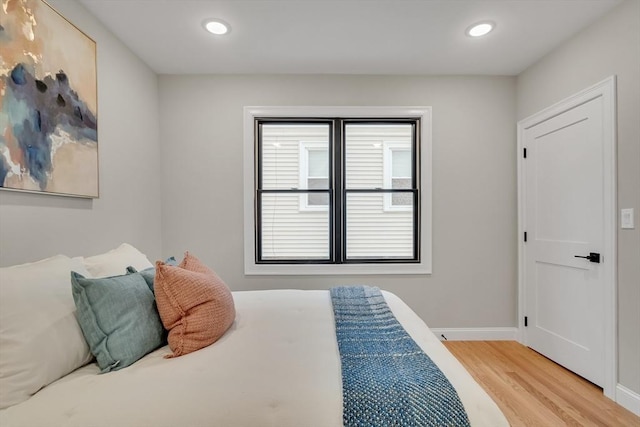 bedroom with hardwood / wood-style flooring