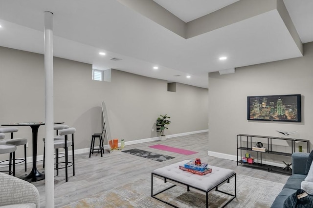 living room with light hardwood / wood-style flooring