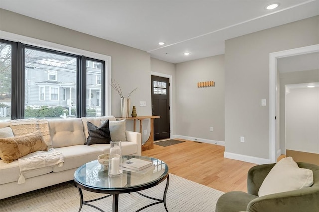 living room with light hardwood / wood-style flooring