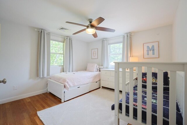 61 Colwell, Dedham, MA 02026 - bedroom with multiple windows, wood finished floors, and a ceiling fan