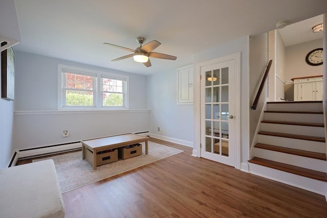 61 Colwell, Dedham, MA 02026 - unfurnished living room with wood finished floors, stairs, and a ceiling fan