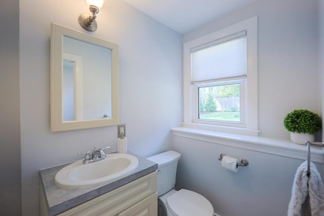 61 Colwell, Dedham, MA 02026 - half bathroom featuring toilet and vanity