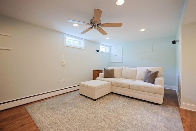 61 Colwell, Dedham, MA 02026 - living area with wood finished floors, recessed lighting, a baseboard heating unit, and a ceiling fan
