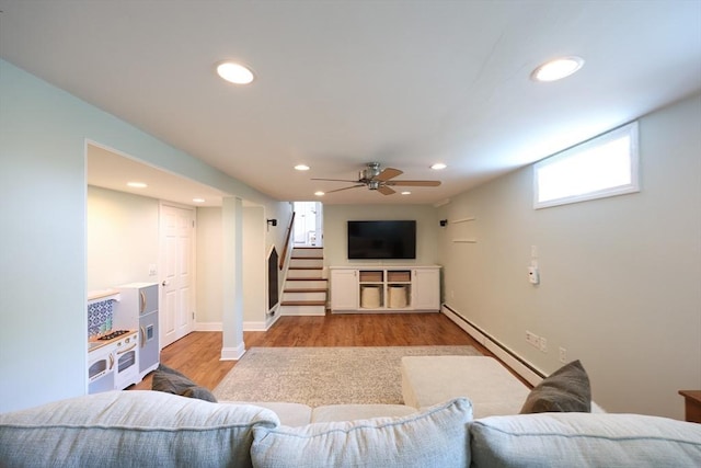 61 Colwell, Dedham, MA 02026 - living area with baseboard heating, wood finished floors, stairway, recessed lighting, and a ceiling fan