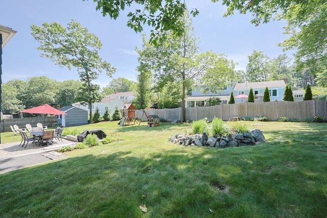 61 Colwell, Dedham, MA 02026 - fenced backyard with a playground and a patio area