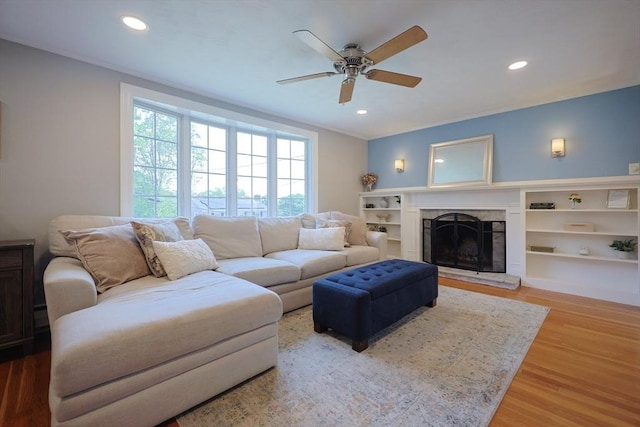 61 Colwell, Dedham, MA 02026 - living room featuring ceiling fan, recessed lighting, wood finished floors, and a fireplace with raised hearth