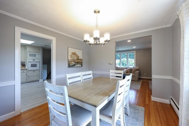 61 Colwell, Dedham, MA 02026 - dining area with a chandelier, light wood-style flooring, a baseboard heating unit, and ornamental molding